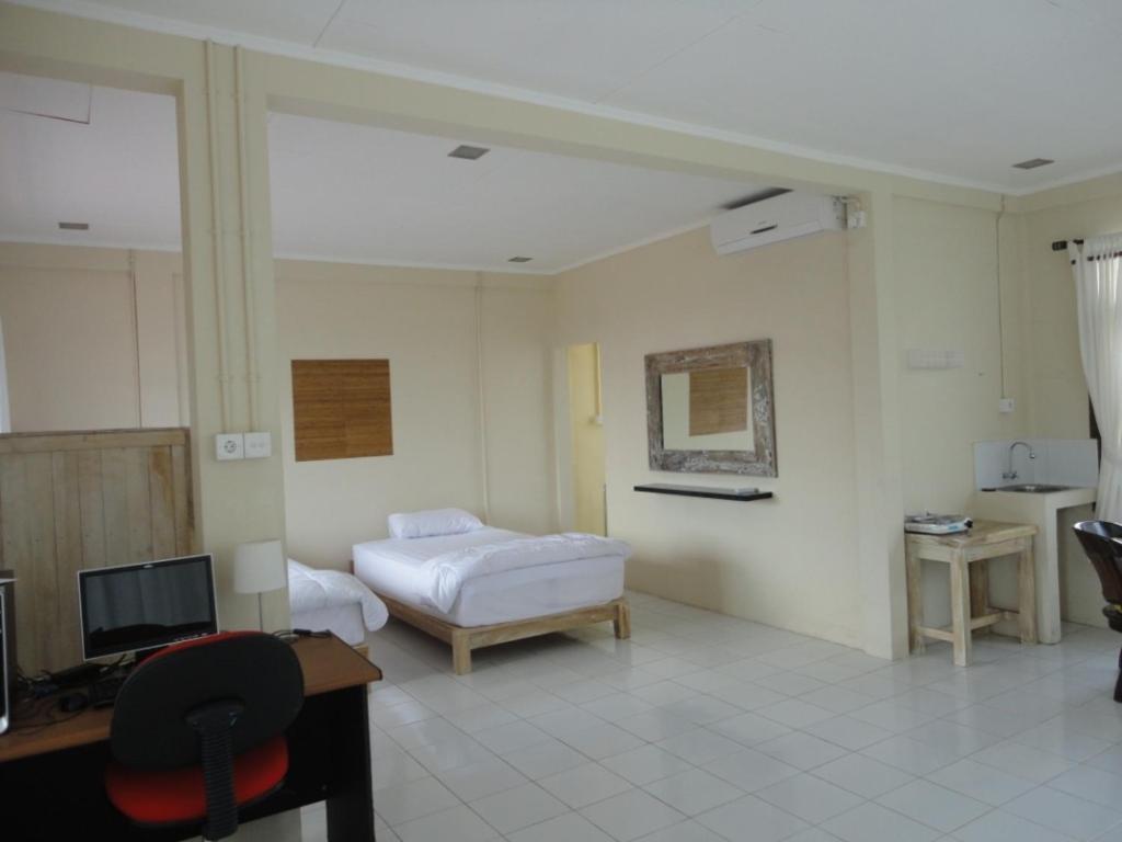 Urbanview Hotel Wayan Mansion Denpasar Pokoj fotografie